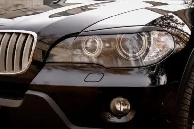 Реснички на фары под покраску для BMW X5 2006-2010 (REBX5-006500)